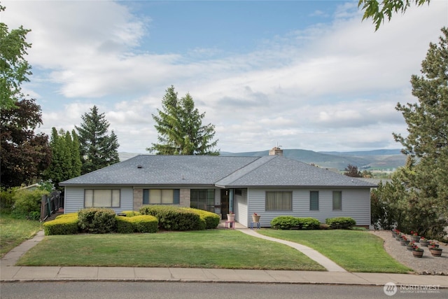 906 E 3rd Ave, Ellensburg, WA 98926 - single story home featuring a front lawn, a shingled roof, and a chimney
