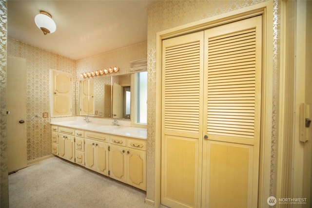 906 E 3rd Ave, Ellensburg, WA 98926 - full bath featuring wallpapered walls, a closet, and double vanity