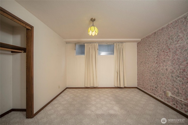 906 E 3rd Ave, Ellensburg, WA 98926 - unfurnished bedroom with carpet, baseboards, and a closet