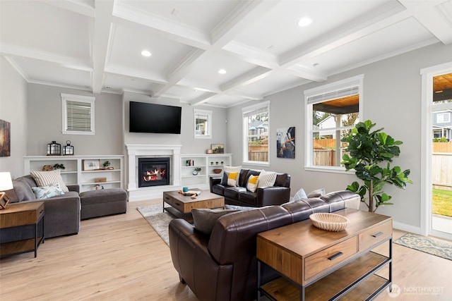 living area featuring light wood-type flooring, beamed ceiling, coffered ceiling, recessed lighting, and plenty of natural light