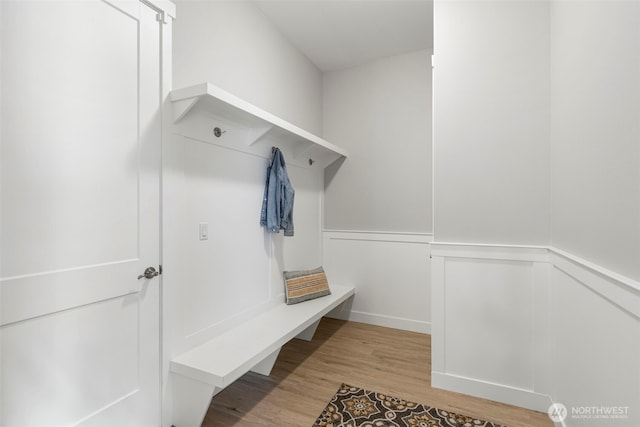mudroom featuring wainscoting and wood finished floors