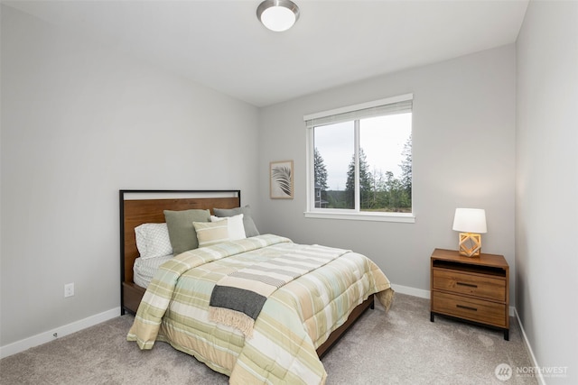 carpeted bedroom with baseboards
