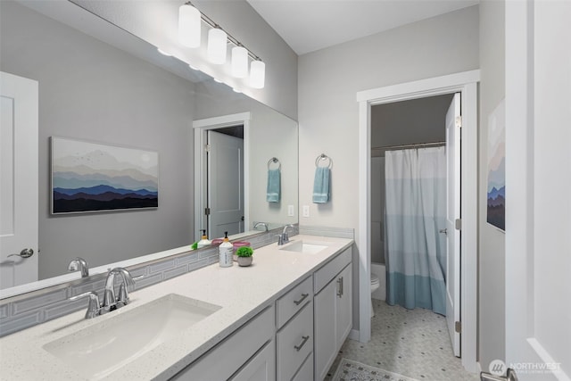 full bath with toilet, double vanity, and a shower with shower curtain
