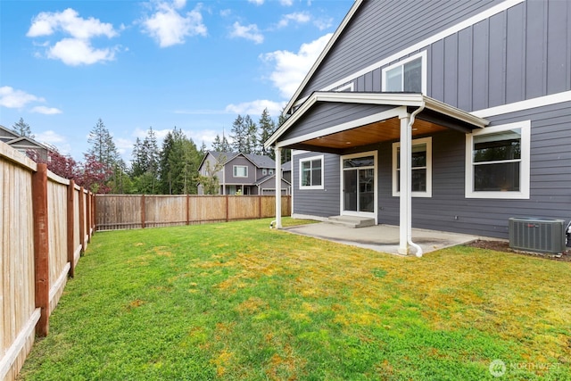 view of yard featuring cooling unit and a patio