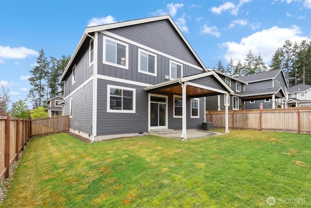 back of property with board and batten siding, a patio area, and central AC unit
