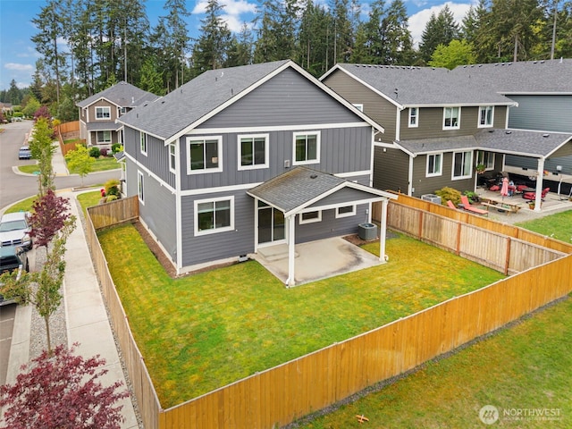 back of house featuring a patio, central air condition unit, board and batten siding, and roof with shingles