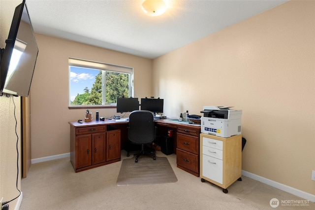home office featuring light colored carpet and baseboards