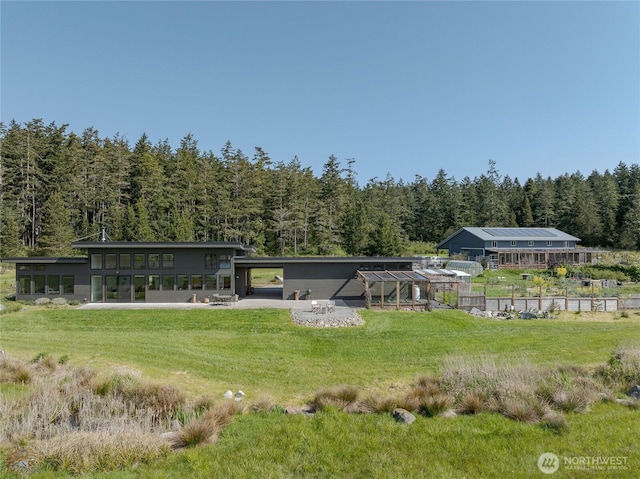 5621 Fisherman Bay Rd, Lopez Island, WA 98261 - back of property with a view of trees and a lawn
