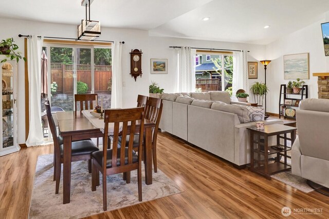 dining space with recessed lighting and light wood-type flooring