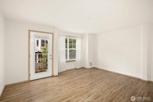 1140 N 92nd Unit B, Seattle, WA 98103 - spare room featuring light wood-type flooring and baseboards