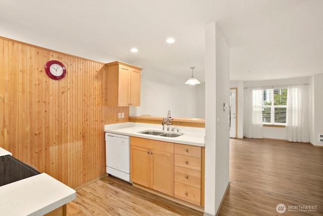 1140 N 92nd Unit B, Seattle, WA 98103 - kitchen with dishwasher, a sink, light brown cabinetry, wooden walls, and light wood-type flooring