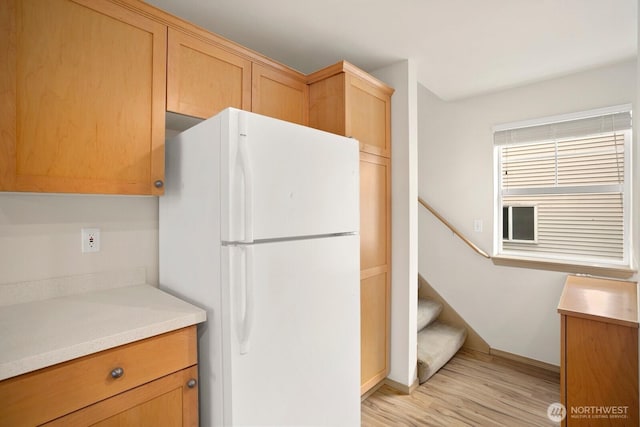 1140 N 92nd Unit B, Seattle, WA 98103 - kitchen with freestanding refrigerator, light wood-type flooring, light countertops, and baseboards