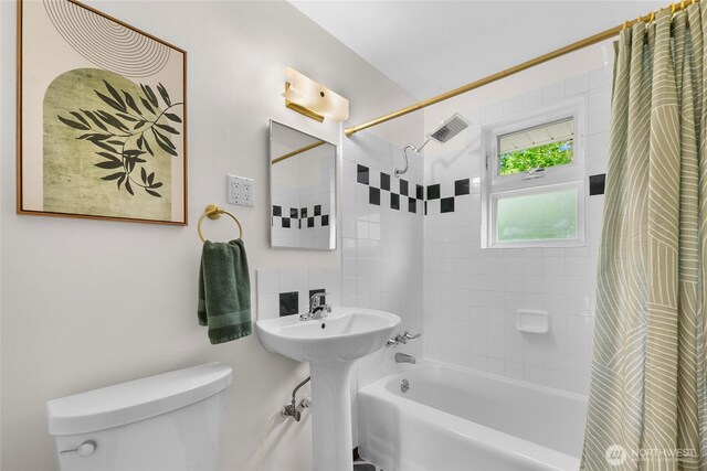 full bath featuring toilet and shower / tub combo