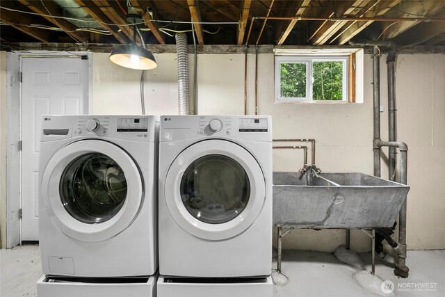 laundry room featuring washing machine and clothes dryer