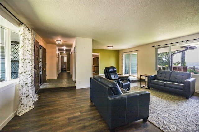1234 Friedlander Dr, Aberdeen, WA 98520 - living area with wood finished floors, a textured ceiling, and baseboards