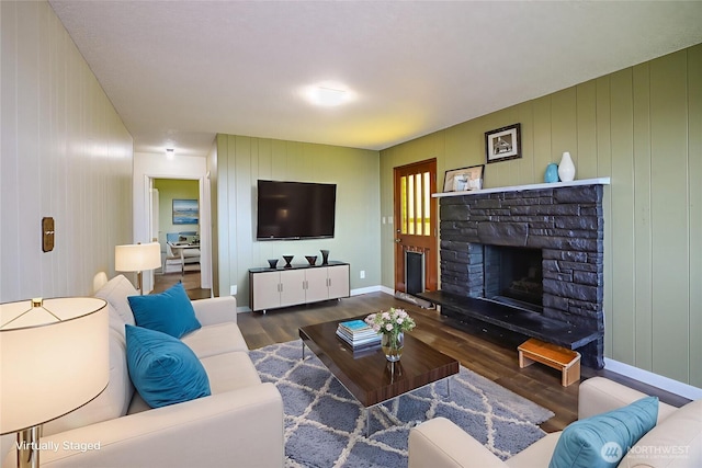 1234 Friedlander Dr, Aberdeen, WA 98520 - living room with wood finished floors, a fireplace, and baseboards