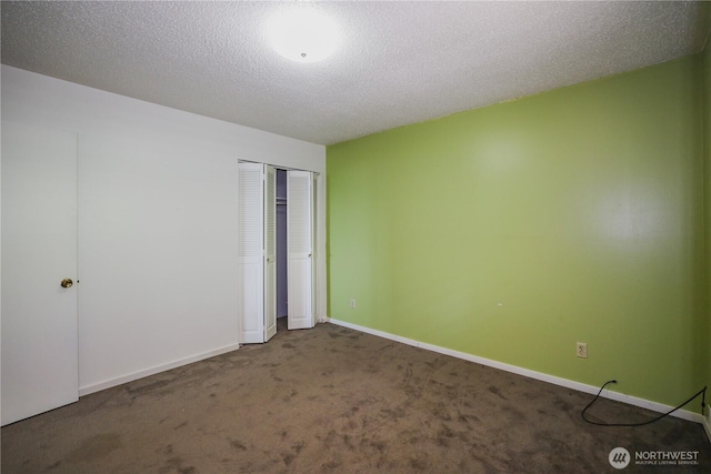 1234 Friedlander Dr, Aberdeen, WA 98520 - unfurnished bedroom with carpet flooring, a closet, a textured ceiling, and baseboards