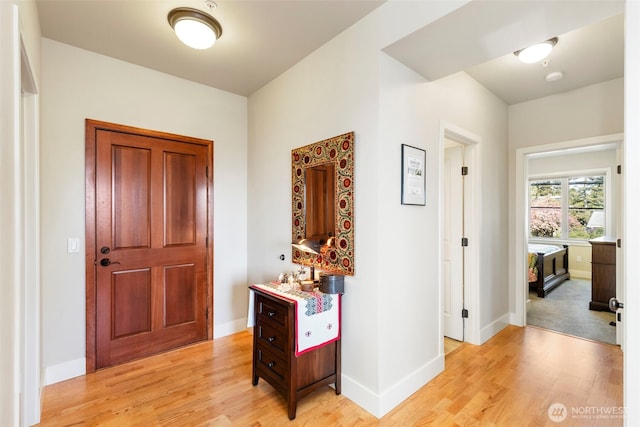 1215 Lawrence St Unit 201, Port Townsend, WA 98368 - corridor featuring light wood-style floors and baseboards