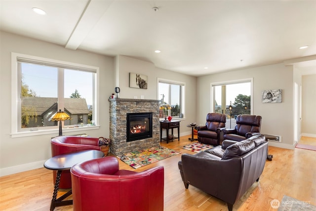 1215 Lawrence St Unit 201, Port Townsend, WA 98368 - living room featuring baseboards, a fireplace, light wood-style flooring, and recessed lighting