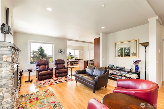1215 Lawrence St Unit 201, Port Townsend, WA 98368 - living area featuring light wood-style flooring, a fireplace, and recessed lighting
