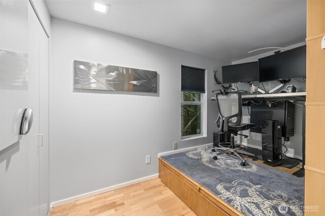 office featuring wood finished floors and baseboards