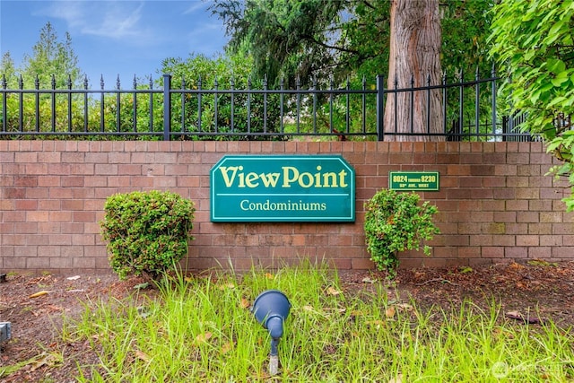community sign with fence