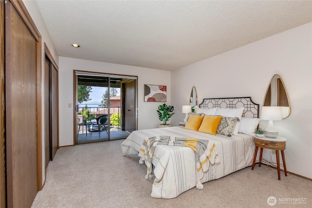 bedroom with access to outside, light colored carpet, a textured ceiling, and baseboards