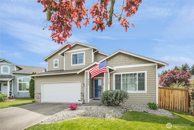 9006 190th St E, Puyallup, WA 98375 - view of front of home with concrete driveway and an attached garage