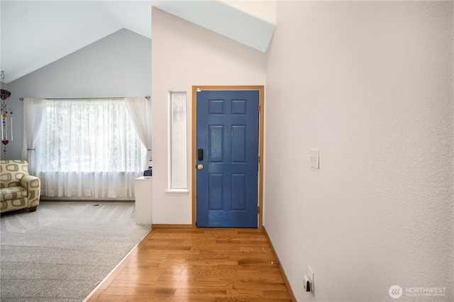 9006 190th St E, Puyallup, WA 98375 - entryway featuring light wood finished floors and high vaulted ceiling