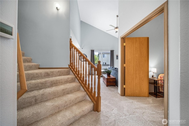 9006 190th St E, Puyallup, WA 98375 - stairway with carpet, a ceiling fan, and vaulted ceiling
