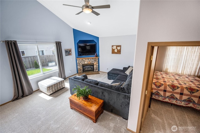 9006 190th St E, Puyallup, WA 98375 - living area with carpet flooring, a ceiling fan, high vaulted ceiling, and a stone fireplace