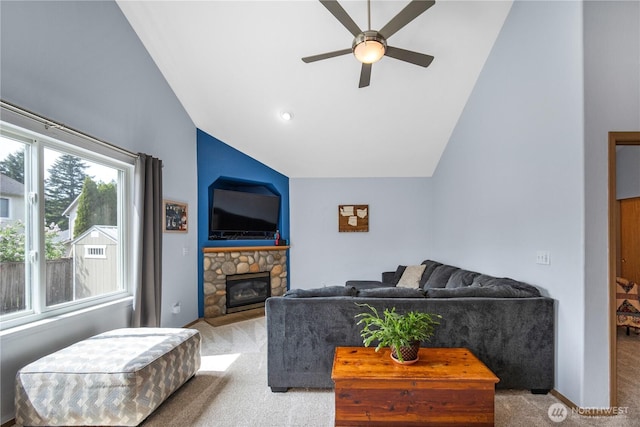 9006 190th St E, Puyallup, WA 98375 - carpeted living area featuring lofted ceiling, ceiling fan, and a stone fireplace