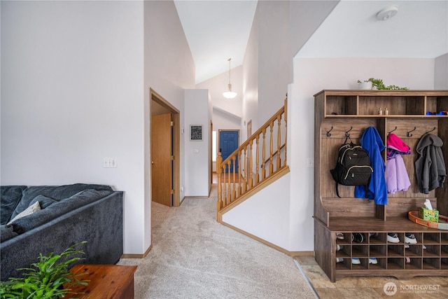 9006 190th St E, Puyallup, WA 98375 - mudroom with carpet flooring, lofted ceiling, and baseboards