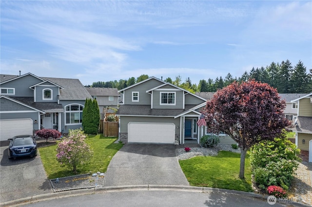 9006 190th St E, Puyallup, WA 98375 - view of front of property with asphalt driveway, a garage, a residential view, stone siding, and roof with shingles