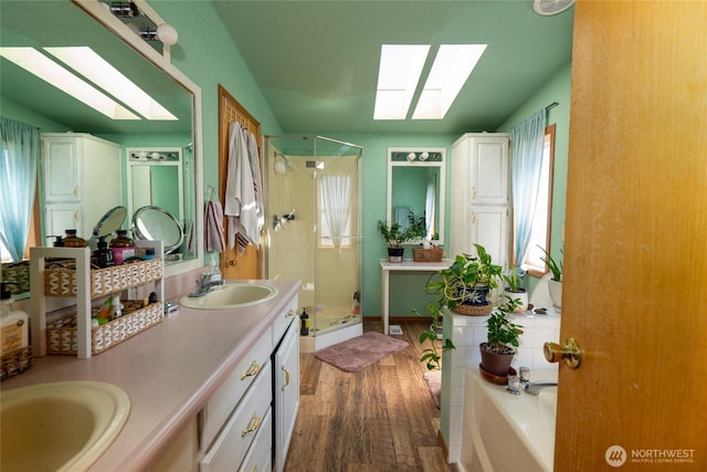 4141 Parke Crk, Ellensburg, WA 98926 - full bath featuring a skylight, wood finished floors, a stall shower, and a garden tub