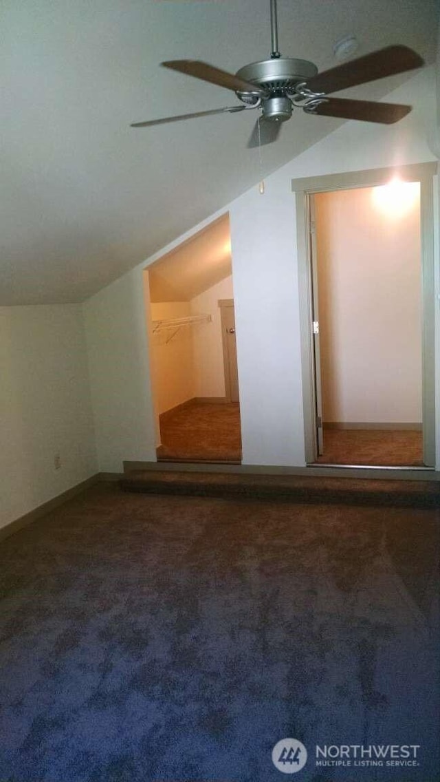 additional living space featuring vaulted ceiling, ceiling fan, and carpet floors