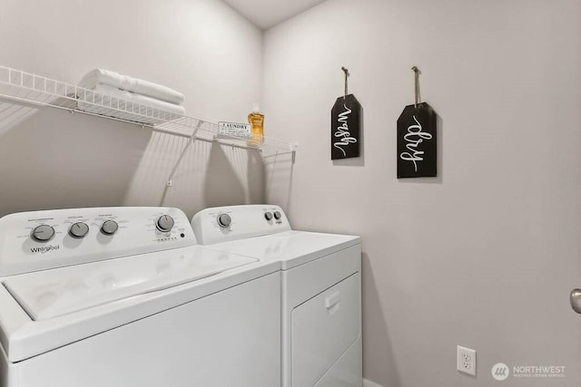 laundry room featuring washing machine and clothes dryer and laundry area