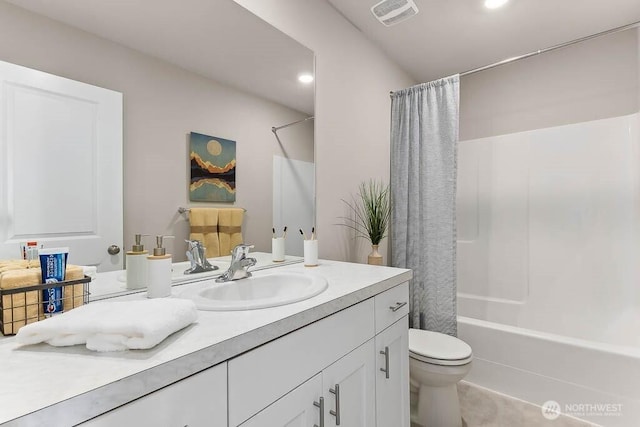 full bath featuring toilet, vanity, visible vents, recessed lighting, and shower / bath combo