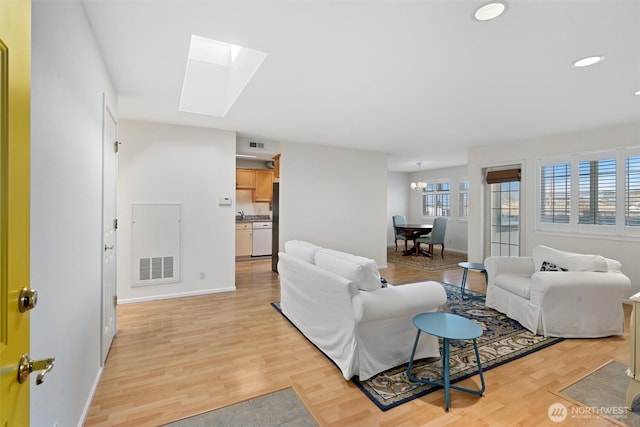 514 Bell St, Edmonds, WA 98020 - living room featuring light wood-style floors, visible vents, a skylight, and recessed lighting