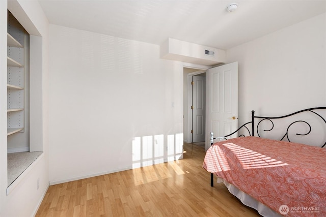 514 Bell St, Edmonds, WA 98020 - bedroom with baseboards, visible vents, and light wood-style floors