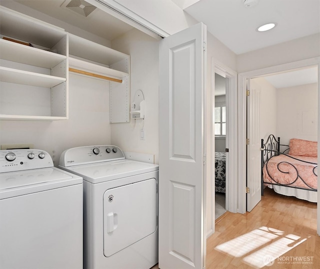 514 Bell St, Edmonds, WA 98020 - washroom featuring washing machine and clothes dryer, laundry area, light wood finished floors, and visible vents