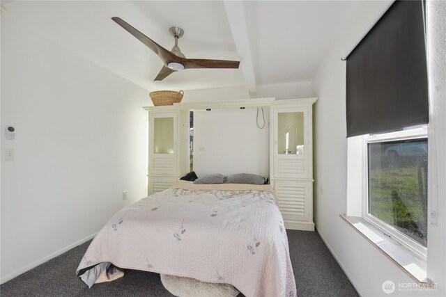11 Ridge Loop Rd, Cle Elum, WA 98922 - bedroom featuring dark colored carpet, baseboards, beam ceiling, and ceiling fan