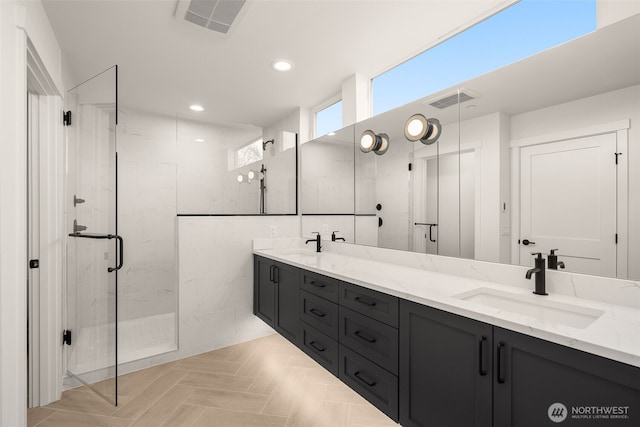 1625B 21st Ave, Seattle, WA 98122 - bathroom featuring a marble finish shower, double vanity, and recessed lighting