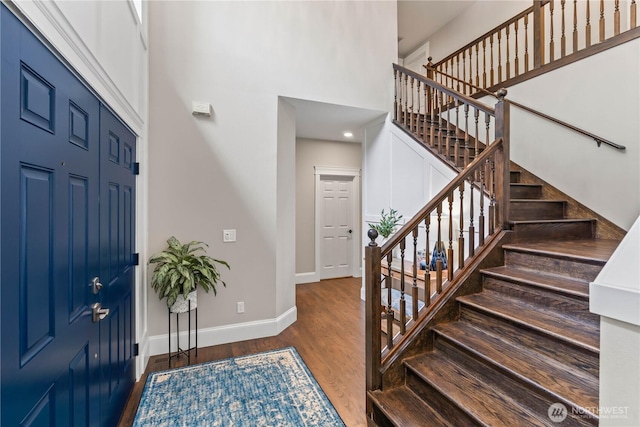 856 Hilltop Ave, Kent, WA 98031 - entryway featuring a high ceiling, baseboards, stairs, and wood finished floors