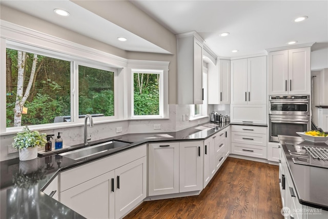 856 Hilltop Ave, Kent, WA 98031 - kitchen with a sink, double oven, recessed lighting, healthy amount of natural light, and dark wood-style flooring