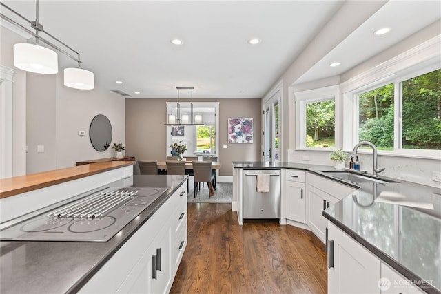 856 Hilltop Ave, Kent, WA 98031 - kitchen featuring stainless steel dishwasher, a sink, dark wood finished floors, recessed lighting, and stovetop with downdraft