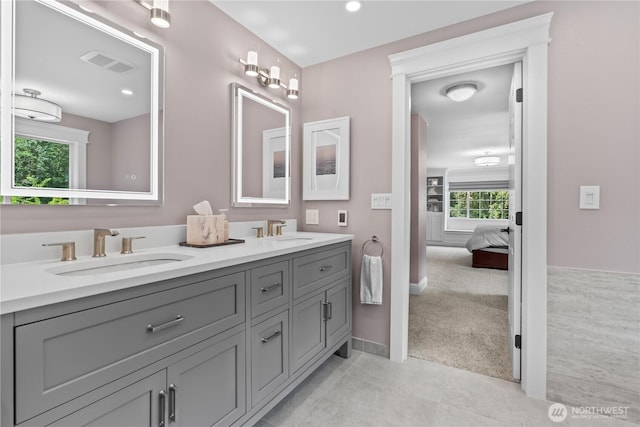 856 Hilltop Ave, Kent, WA 98031 - ensuite bathroom with double vanity, baseboards, recessed lighting, and tile patterned floors
