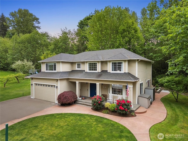 856 Hilltop Ave, Kent, WA 98031 - traditional-style house featuring asphalt driveway, a porch, an attached garage, a front yard, and a shingled roof
