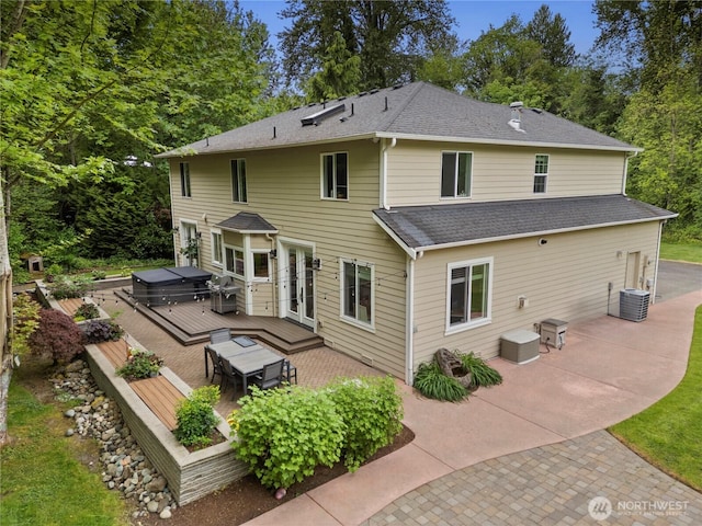 856 Hilltop Ave, Kent, WA 98031 - rear view of house with a hot tub, a wooden deck, a patio, a shingled roof, and central air condition unit