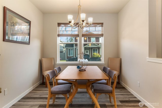 3215 64th Ln SW, Olympia, WA 98512 - dining area with baseboards, an inviting chandelier, and wood finished floors